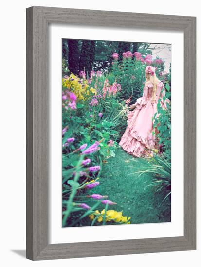 A Beautiful Princess with Long Blond Hair Wanders Through a Garden of Pretty Flowers-Winter Wolf-Framed Photographic Print