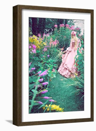 A Beautiful Princess with Long Blond Hair Wanders Through a Garden of Pretty Flowers-Winter Wolf-Framed Photographic Print