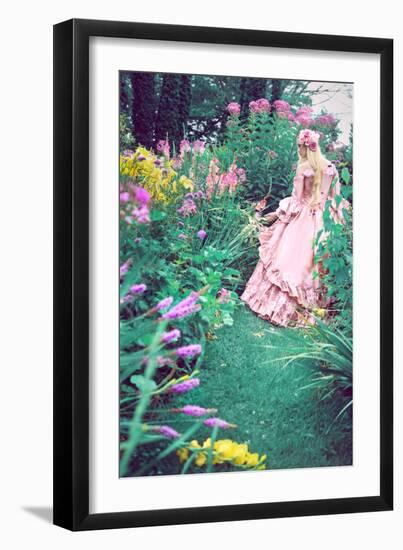 A Beautiful Princess with Long Blond Hair Wanders Through a Garden of Pretty Flowers-Winter Wolf-Framed Photographic Print