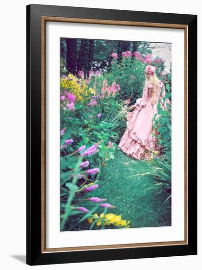 A Beautiful Princess with Long Blond Hair Wanders Through a Garden of Pretty Flowers-Winter Wolf-Framed Photographic Print