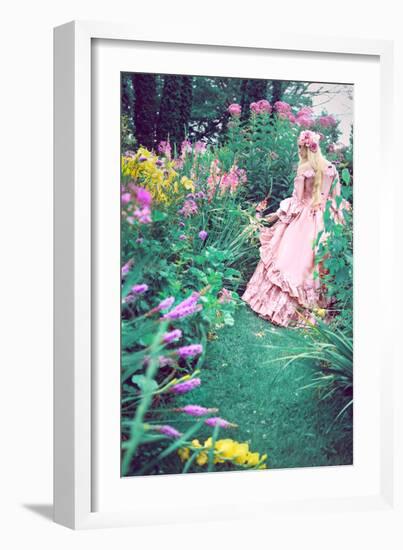 A Beautiful Princess with Long Blond Hair Wanders Through a Garden of Pretty Flowers-Winter Wolf-Framed Photographic Print