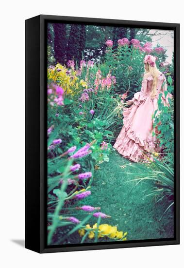 A Beautiful Princess with Long Blond Hair Wanders Through a Garden of Pretty Flowers-Winter Wolf-Framed Premier Image Canvas