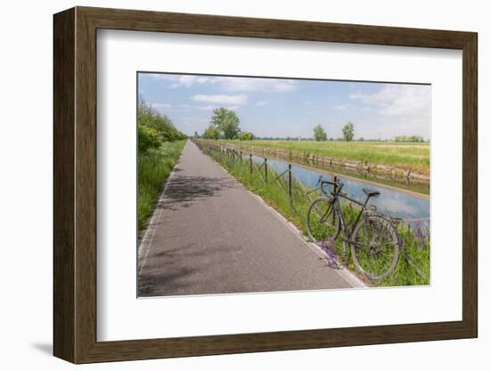 A bike on the rail of the Naviglio Pavense canal which links Milan to Pavia which has been transfor-Alexandre Rotenberg-Framed Photographic Print