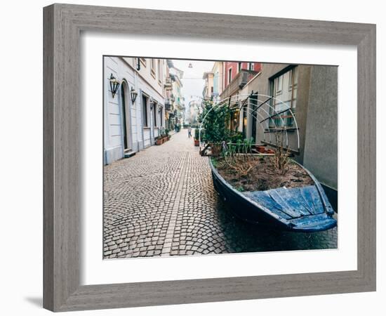 A boat filled with plants on a street in Stresa, Piedmont, Italy, Europe-Alexandre Rotenberg-Framed Photographic Print