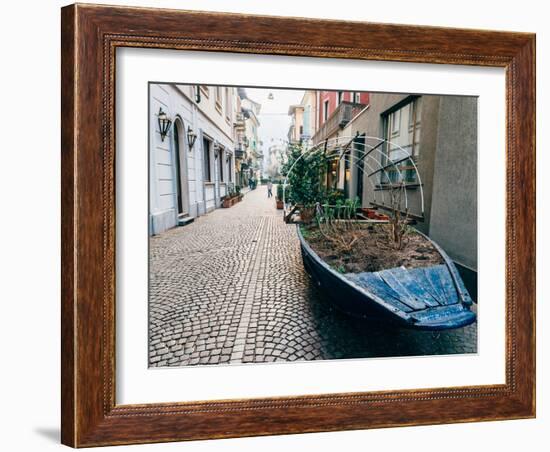 A boat filled with plants on a street in Stresa, Piedmont, Italy, Europe-Alexandre Rotenberg-Framed Photographic Print