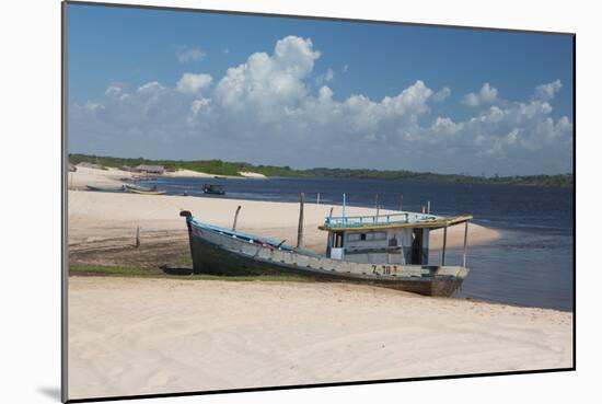 A Boat Sits on Rio Preguicas River Bank Near Lencois Maranhenses National Park-Alex Saberi-Mounted Photographic Print