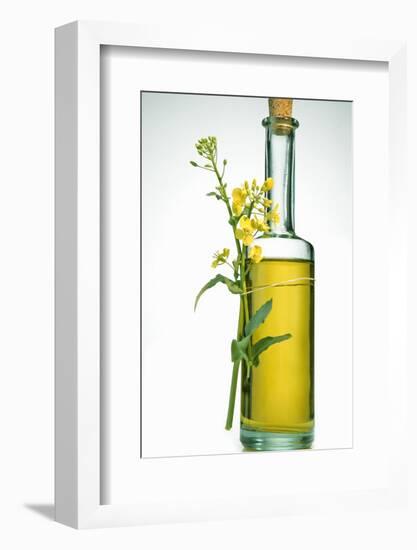 A Bottle of Rapeseed Oil with Flowers-Bodo A^ Schieren-Framed Photographic Print