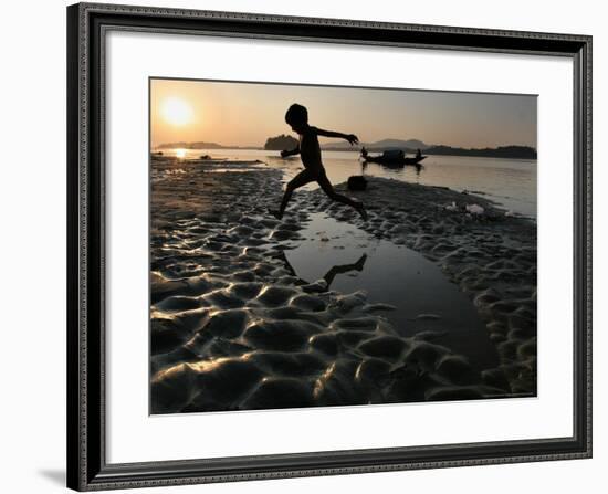 A Boy Plays on the Banks of the River Brahmaputra in Gauhati, India, Friday, October 27, 2006-Anupam Nath-Framed Photographic Print