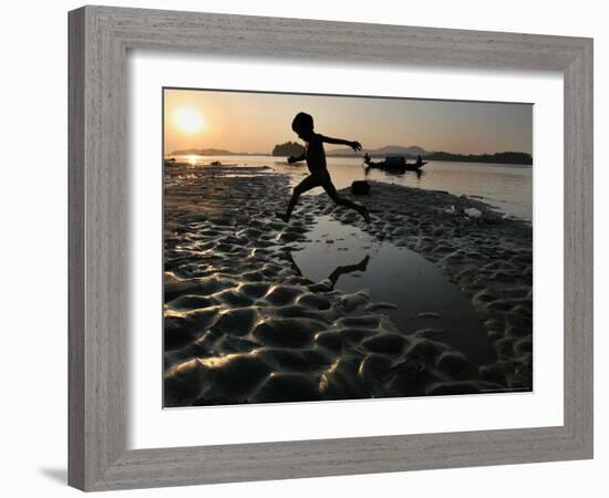 A Boy Plays on the Banks of the River Brahmaputra in Gauhati, India, Friday, October 27, 2006-Anupam Nath-Framed Photographic Print