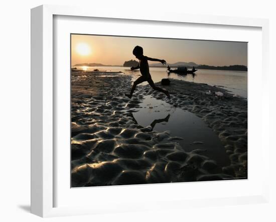 A Boy Plays on the Banks of the River Brahmaputra in Gauhati, India, Friday, October 27, 2006-Anupam Nath-Framed Photographic Print