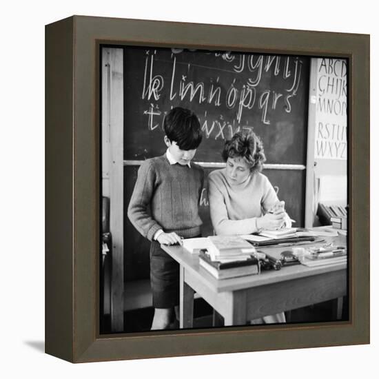 A Boy Pupil Reading with His Teacher, at Her Desk in Front of the Blackboard-Henry Grant-Framed Premier Image Canvas