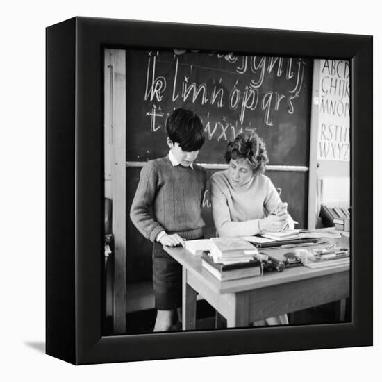 A Boy Pupil Reading with His Teacher, at Her Desk in Front of the Blackboard-Henry Grant-Framed Premier Image Canvas