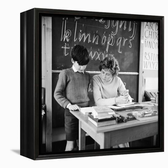 A Boy Pupil Reading with His Teacher, at Her Desk in Front of the Blackboard-Henry Grant-Framed Premier Image Canvas