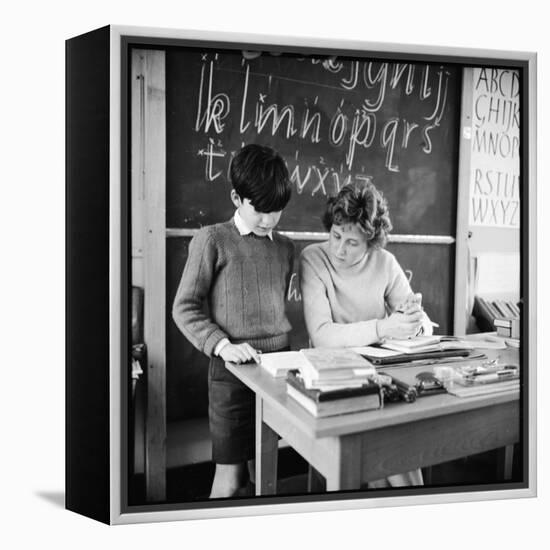 A Boy Pupil Reading with His Teacher, at Her Desk in Front of the Blackboard-Henry Grant-Framed Premier Image Canvas