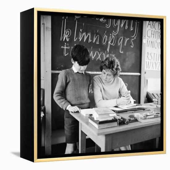 A Boy Pupil Reading with His Teacher, at Her Desk in Front of the Blackboard-Henry Grant-Framed Premier Image Canvas