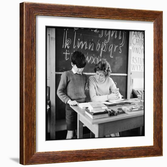 A Boy Pupil Reading with His Teacher, at Her Desk in Front of the Blackboard-Henry Grant-Framed Photographic Print