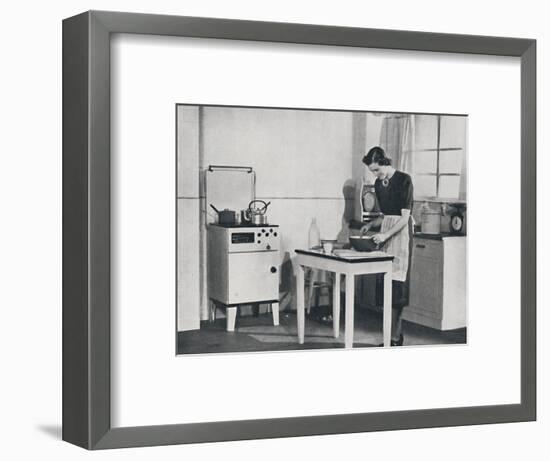 'A British kitchen equipped with a cabinet gas cooker', 1942-Unknown-Framed Photographic Print