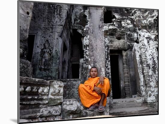 A Buddhist Monk Relaxes in the Bayon Temple, Angkor, Unesco World Heritage Site, Cambodia-Andrew Mcconnell-Mounted Photographic Print