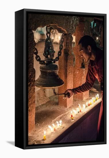 A Buddhist Monk Rings a Prayer Bell During the Full Moon Celebrations-Andrew Taylor-Framed Premier Image Canvas