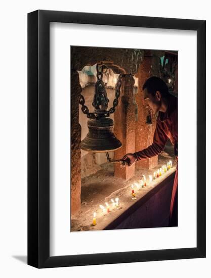 A Buddhist Monk Rings a Prayer Bell During the Full Moon Celebrations-Andrew Taylor-Framed Photographic Print