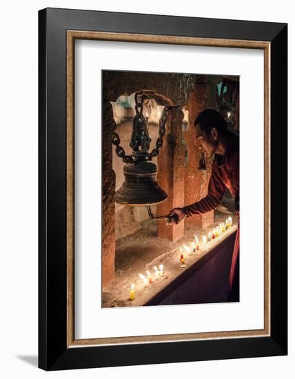 A Buddhist Monk Rings a Prayer Bell During the Full Moon Celebrations-Andrew Taylor-Framed Photographic Print