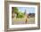 A buddhist monk walks past Wat Si Saket (Wat Sisaket) temple in central Vientiane, Laos-Jason Langley-Framed Photographic Print