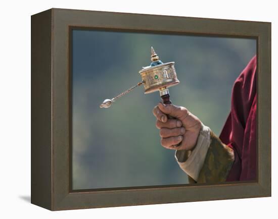 A Buddhist Spins His Hand-Held Prayer Wheel in a Clockwise Direction with the Help of a Weighted Ch-Nigel Pavitt-Framed Premier Image Canvas