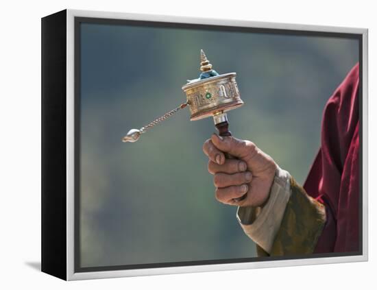 A Buddhist Spins His Hand-Held Prayer Wheel in a Clockwise Direction with the Help of a Weighted Ch-Nigel Pavitt-Framed Premier Image Canvas