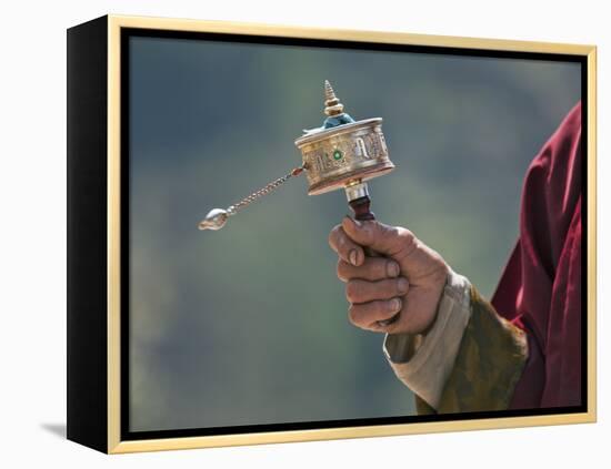 A Buddhist Spins His Hand-Held Prayer Wheel in a Clockwise Direction with the Help of a Weighted Ch-Nigel Pavitt-Framed Premier Image Canvas