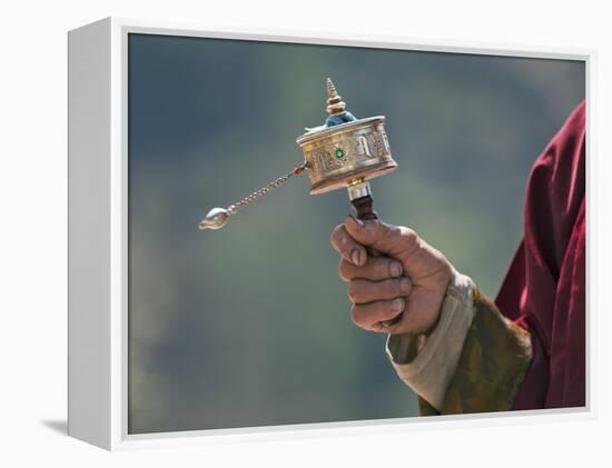 A Buddhist Spins His Hand-Held Prayer Wheel in a Clockwise Direction with the Help of a Weighted Ch-Nigel Pavitt-Framed Premier Image Canvas