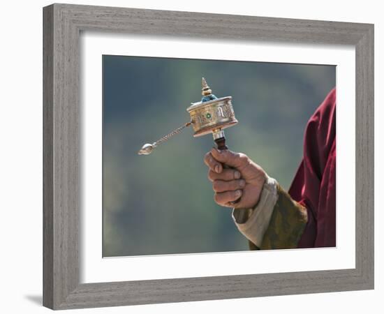 A Buddhist Spins His Hand-Held Prayer Wheel in a Clockwise Direction with the Help of a Weighted Ch-Nigel Pavitt-Framed Photographic Print