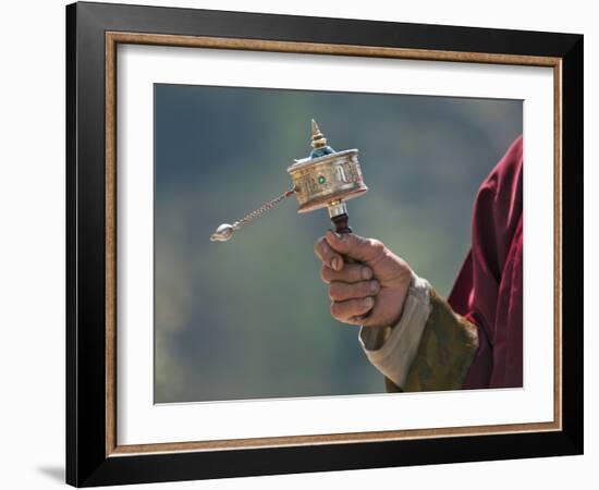 A Buddhist Spins His Hand-Held Prayer Wheel in a Clockwise Direction with the Help of a Weighted Ch-Nigel Pavitt-Framed Photographic Print