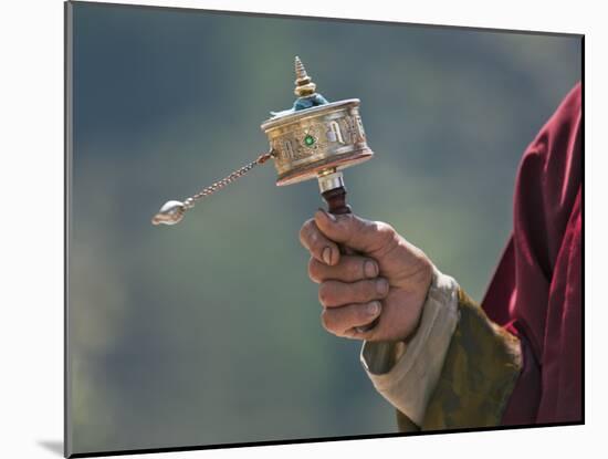 A Buddhist Spins His Hand-Held Prayer Wheel in a Clockwise Direction with the Help of a Weighted Ch-Nigel Pavitt-Mounted Photographic Print