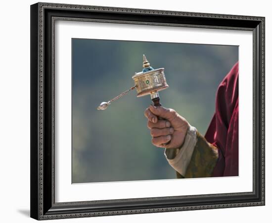 A Buddhist Spins His Hand-Held Prayer Wheel in a Clockwise Direction with the Help of a Weighted Ch-Nigel Pavitt-Framed Photographic Print