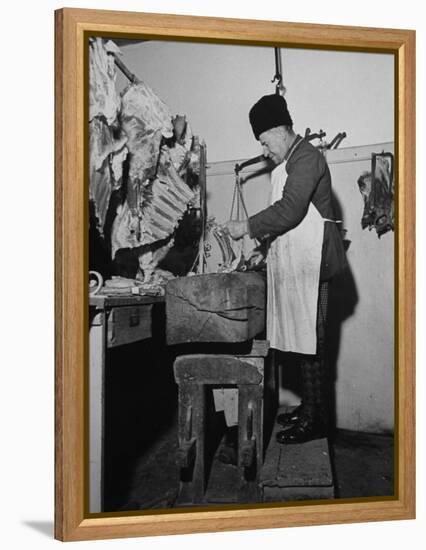 A Butcher Working in the Hungarian Meat Shop-John Phillips-Framed Premier Image Canvas