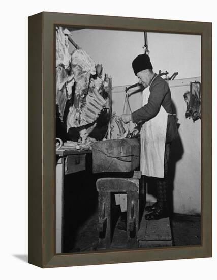 A Butcher Working in the Hungarian Meat Shop-John Phillips-Framed Premier Image Canvas