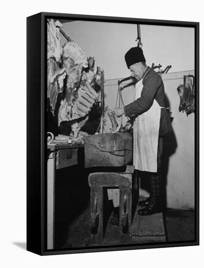 A Butcher Working in the Hungarian Meat Shop-John Phillips-Framed Premier Image Canvas