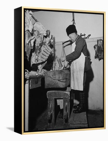 A Butcher Working in the Hungarian Meat Shop-John Phillips-Framed Premier Image Canvas