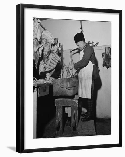 A Butcher Working in the Hungarian Meat Shop-John Phillips-Framed Premium Photographic Print