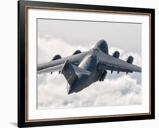 A C-17 Globemaster Flying Above the Clouds over Nellis Air Force Base, Nevada-Stocktrek Images-Framed Photographic Print