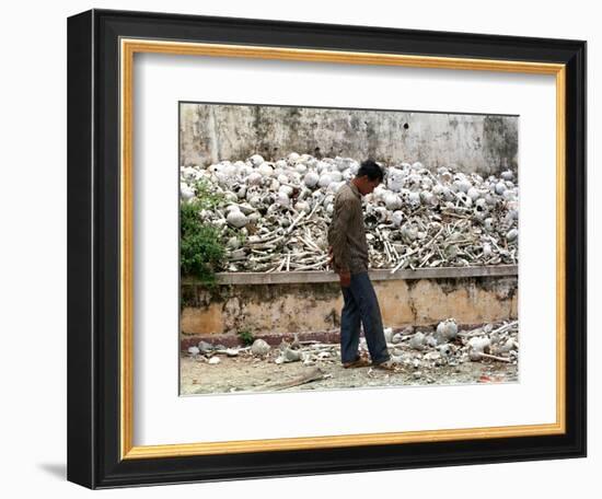 A Cambodian Man Walks Past One of the Many Killing Fields Sites-null-Framed Premium Photographic Print