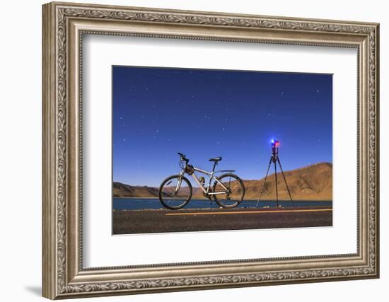 A Camera, Tripod and Bicycle on a Full Moon Night at Yamdrok Lake, Tibet, China-Stocktrek Images-Framed Photographic Print
