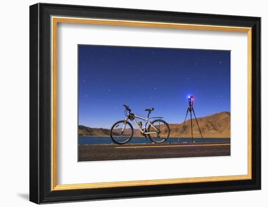 A Camera, Tripod and Bicycle on a Full Moon Night at Yamdrok Lake, Tibet, China-Stocktrek Images-Framed Photographic Print