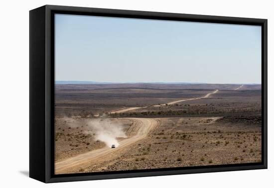 A Car Leaves a Cloud of Dust as it Apporachs Along the Long Dusty Road from the Fish River Canyon-Alex Treadway-Framed Premier Image Canvas