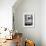 A Cat Joins its Owner Reading a Book at a Tokyo Cafe-null-Framed Photographic Print displayed on a wall