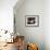 A Cat Joins its Owner Reading a Book at a Tokyo Cafe-null-Framed Photographic Print displayed on a wall