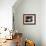 A Cat Joins its Owner Reading a Book at a Tokyo Cafe-null-Framed Photographic Print displayed on a wall