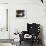 A Cat Joins its Owner Reading a Book at a Tokyo Cafe-null-Framed Photographic Print displayed on a wall