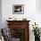 A Cat Joins its Owner Reading a Book at a Tokyo Cafe-null-Framed Photographic Print displayed on a wall