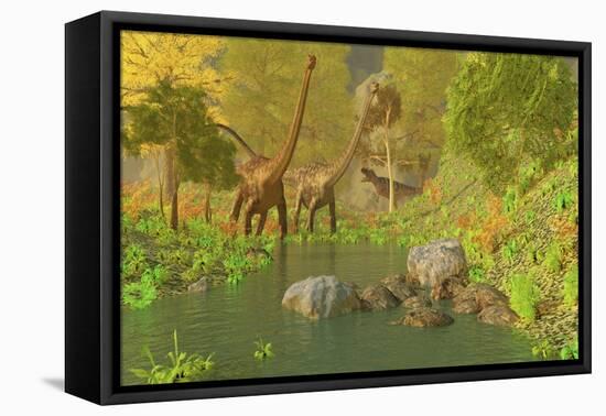 A Ceratosaurus Tries to Sneak Up Behind Two Diplodocus Dinosaurs-Stocktrek Images-Framed Stretched Canvas